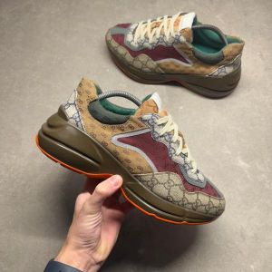 Guccci Rhyton sneakers GG Supreme monogram paneled design GG Supreme monogram